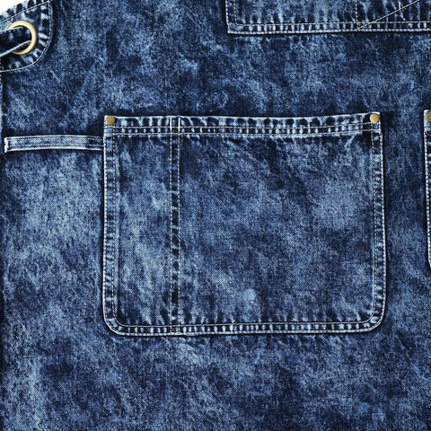 Close-up of pocket on Denim Apron For Men With Towel Loop And Tool Pockets, Special Washed Style With Water Resistant Finish in Blue Black.