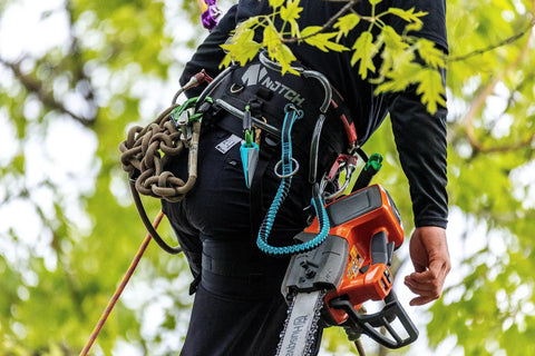 Arborist climbing tree with Quick Cinch Chainsaw Lanyard With Double End Attachments 60 Inch Reach For Easy Carabiner Storage Ring Clip On Harness Rugged Safety Lanyard Designed For Pros And Weekend Tree Guys