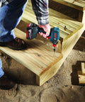 Person using 10-Pack 3 And A Half Inch Phillips No. 1 Impact Tough Screwdriving Bits for High Torque Applications on wooden stairs