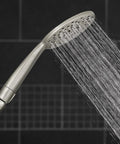 UltraThin Handheld Shower Head With PowerPulse Massage, Five Spray Modes, Large Six Inch Rainfall Head, Brushed Nickel Finish in use.
