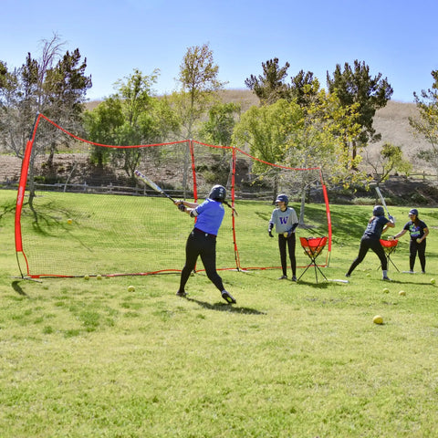 Portable Sports Barrier Net Great For Baseball Softball Lacrosse Tennis Football And More Two Size Options 12 Ft By 9 Ft Or 20 Ft By 10 Ft Includes Carry Bag Perfect Backyard Practice Net For Any Ball Over 2.5 Inches In Diameter with players practicing baseball in a backyard.