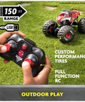Remote control being used with Spider Man RC Monster Truck Mega Size Over Two Feet Long One Six Scale All Terrain Off Road Toy