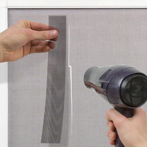 Applying Window Screen Repair Kit Patch 5 By 7 Inch Silver Gray DIY Quick Fix For Tears And Rips In Screens using hair dryer