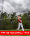 Child practicing baseball swing in 60 Foot Batting Cage Complete Package With Frame And Netting, Easy-Collapsible Baseball And Softball Practice Enclosure For Backyard Hitters, Quick Assembly, Secure Click-Together Poles in backyard.