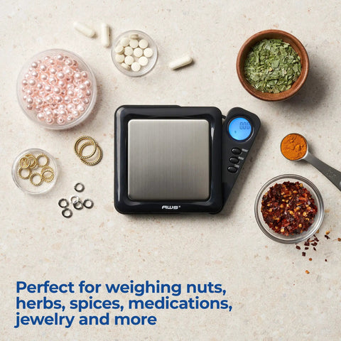 Pocket Digital Scale 100g x 0.01g High Precision Gram Scale With LCD Display among spices and jewelry items on counter