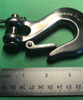 Close-up of 316 Stainless Steel Clevis Slip Hook With Safety Latch Five Sixteenth Inch Marine Grade next to ruler