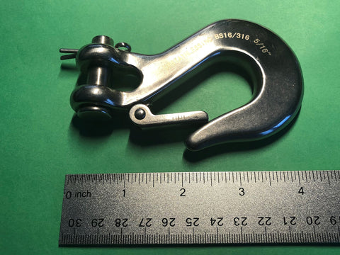 Close-up of 316 Stainless Steel Clevis Slip Hook With Safety Latch Five Sixteenth Inch Marine Grade next to ruler