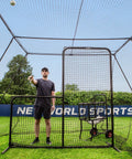 Man pitching ball inside Trapezoid Baseball Batting Cage Kit With Complete Cage, Connector Set, And Premium Net Package For 55Ft Practice Tunnel