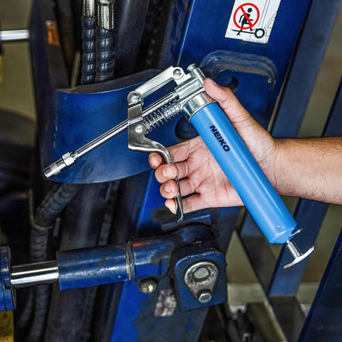 Heavy Duty Mini Grease Gun Kit With Pistol Grip, 4500 PSI, 3oz Cartridges, Zerk Fitting, 5.75 Inch Straight Extension in use