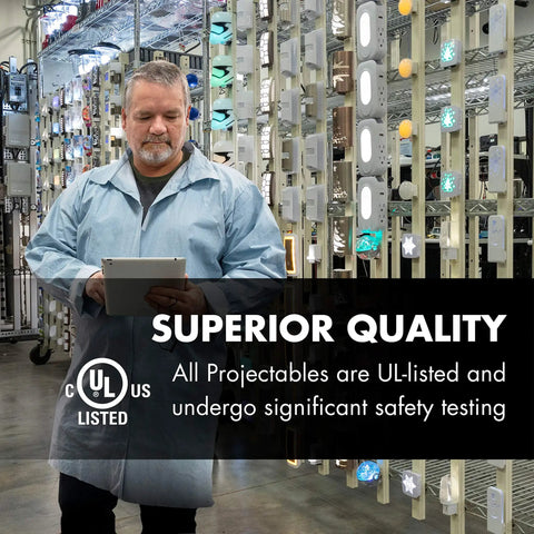 Technician inspecting Projectables products in quality testing lab with safety certifications visible in background.