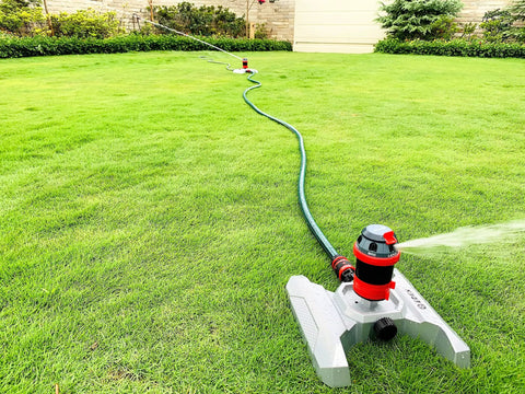 Six Pattern Rotary Sprinkler With Metal Base And Quiet Operation Adjustable Coverage From Five To Three Hundred Sixty Degrees Flow Through Design For Lawn Watering Quick Connect Starter Set Included on a green lawn