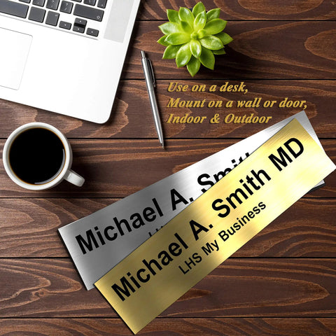 Custom Engraved Brushed Brass Office Door Name Plate And Personalized Desk Sign Featuring Sleek Metal Construction Easy Cubicle Wall Or Adhesive Mount For Bosses Crushing It Daily on a wooden desk with coffee and a laptop.