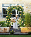 Heavy Duty Garden Arch Trellis For Climbing Plants Outdoor Metal Arbor Support For Raised Bed Cucumber Tomato Grape Plants Rust Resistant Coated Steel Frame 6.7 Ft Tall Durable Plant Stand For Veggies And Flowers showcasing lush climbing flowers
