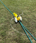 Traveling Sprinkler That Rolls Across Large Lawns Up To 13,500 Sq Ft Cast Iron Outdoor Water Sprinkler with adjustable arms on grass.
