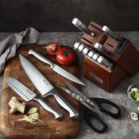 German Stainless Steel Kitchen Knife Set With Built In Sharpener In Self Sharpening Block displayed with food ingredients