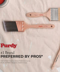 Two Purdy paint brushes on drop cloth, showcasing quality design. Ideal for precise painting and coatings.