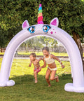 Children playing under Inflatable Unicorn Arch Sprinkler For Kids Rainbow Water Curtain Toy For Outdoor Play Backyard Summer Water Party Easy Setup 82 By 65 Inches Kid Safe Summer Fun Totally