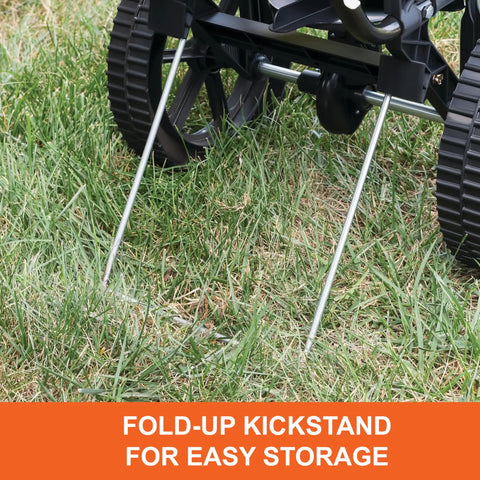 50 Lb Push Lawn And Garden Broadcast Spreader for seed and fertilizer, fold-up kickstand resting on grass, walk behind use.