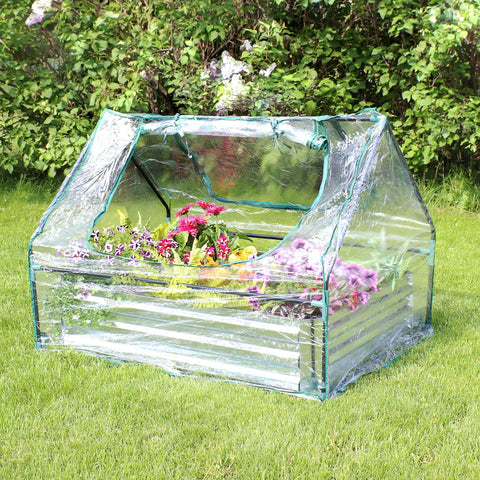 Steel Raised Garden Bed With Mini Greenhouse Cover For Outdoor Growing, featuring flowers inside clear weatherproof cover on grass.