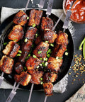 Grilled meat on flat 16 inch kabob skewers with push bar for grilling and camping, stainless steel 304 BBQ skewers, reusable wide shish kabob sticks, 8 pack for easy, even cooking and no rust.