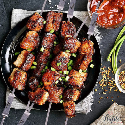Grilled meat on flat 16 inch kabob skewers with push bar for grilling and camping, stainless steel 304 BBQ skewers, reusable wide shish kabob sticks, 8 pack for easy, even cooking and no rust.