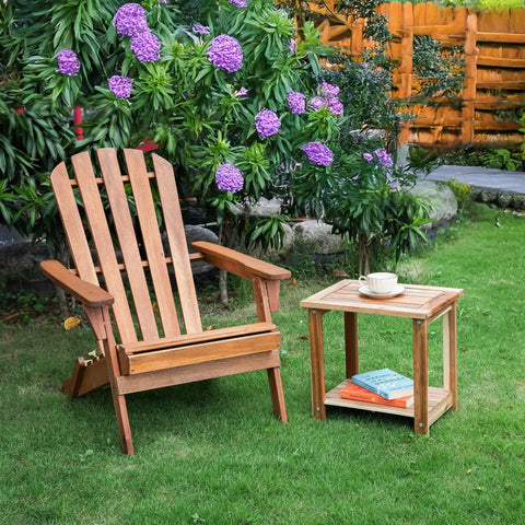 Solid Acacia Wood Side Table With Two Tier Storage For Indoor And Outdoor Use No Fuss Assembly End Table For Living Room And Patio Weather Resistant Light Natural Rustic Finish next to wooden chair on grass