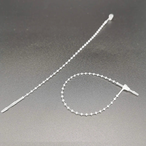 5 Inch Security Beaded Loop Ties Plastic Price Tag Fasteners Adjustable Pin Lock Merchandise Seals For Clothing Shoes And Luggage 1000 Pack White on dark background.