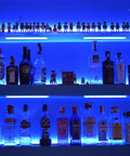 Blue-lit bar shelves showcasing bottles with Six Pack RGB Under Cabinet Lights With Remote And App Control Dope Lighting.