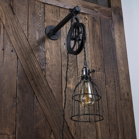 Industrial Pulley Wall Sconce Kit With Wire Cage Shade And Pipe Bracket Plug In 10 Inch Cord On Off Switch And Edison LED Bulb Included Black Pendant Light For Living Room Bar Kitchen installed on wooden wall