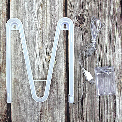 LED Neon Letters Sign Warm White Wall Decor Alphabet M with battery pack and USB cable on wooden background