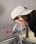 Person using Deck Mounted Emergency Eyewash Faucet With Swivel Spout For Left Hand Mounting Dual Function Eye Wash Unit in action