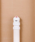 Front view of a white Oatey Sure-Vent air admittance valve on a PVC pipe