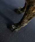 Heavy Duty Vinyl Round Rib Floor Mat For Tough Garages And Workshops Rock Solid One Eighth Inch Thick build with dog paws on it.
