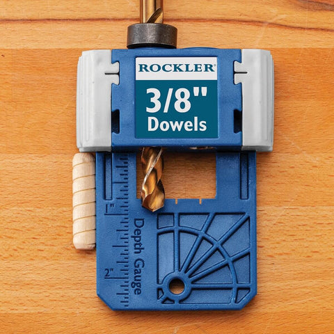 Close-up of 3/8 Inch Doweling Jig Kit With Drill Bit and Stop Collar on wood surface, featuring depth gauge markings.