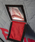 Close-up of the trip proof roll down door on the Heavy Duty Pop Up Insulated Ice Fishing Shelter With Knockout Spacious Fishin Spot For Five To Seven Crews Quick Roll Setup Trip Proof Door Wide Flared Bottom Red Black 94 Square Feet.