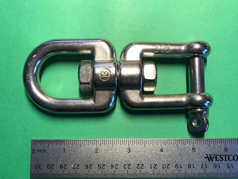 Marine Grade Stainless Steel 316 Anchor Swivel Featuring Heavy Duty Eye And Jaw One Half Inch Thick Rust Proof Marine Hardware Built Tough As Nails To Handle 2750 Pounds While Spinning Butter Smooth For Zero Messy Lines All Day Long, close-up view with ruler for size reference.