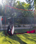Portable 10x7ft Golf Practice Net With Carry Bag set up in backyard with golf bag beside sturdy frame, for indoor outdoor training