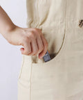 Hand placing Six Inch Adjustable Wrench With Hex Jaw Opens To Three Quarter Inch SAE And Metric Sizes Etched in pocket