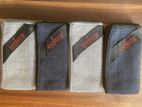 Barista Microfiber Cloths 4 Pack For Espresso Machines And Coffee Stations Pro Grade Cleaning Towels folded on wood surface