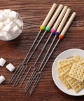 Telescoping Stainless Steel Roasting Sticks 32 Inch 5 Pack Marshmallow Skewers with wood handles on table with marshmallows