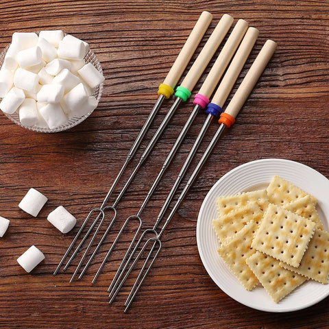Telescoping Stainless Steel Roasting Sticks 32 Inch 5 Pack Marshmallow Skewers with wood handles on table with marshmallows