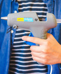 Heavy Duty Full Size Hot Glue Gun Kit With Pack Of Eight Eight Inch Multi Temp Glue Sticks For Woodworking Home Repair shown in hand.