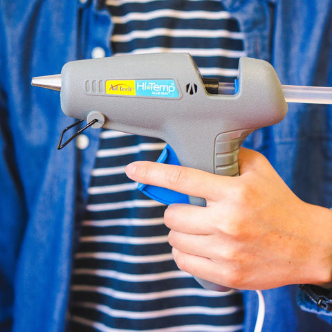 Heavy Duty Full Size Hot Glue Gun Kit With Pack Of Eight Eight Inch Multi Temp Glue Sticks For Woodworking Home Repair shown in hand.