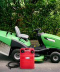 Portable 6 Gallon Boat Fuel Tank Kit For Outboard Engines With Easy Fill Hose Durable Plastic Marine Gas Tank For Pontoon And Small Boats Spill Proof Design Safe And Ready To Go on ground near green lawnmower.