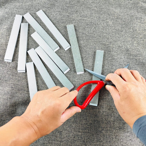 10 Piece Diamond Knife Sharpening Stone Kit With Aluminum Blank Plates For Pro RX008 Knife Sharpener Includes 80 200 400 500 600 800 1000 1500 2000 3000 Grit Smooth Electroplated Surface For Home Chefs And Pros in use, showing knife sharpening process