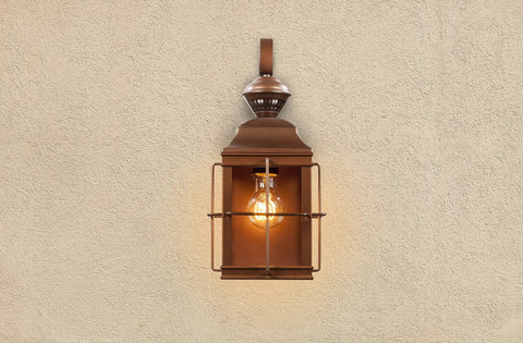 Dual Brite Dimmable Motion Activated Decorative Light with Antique Bronze Finish, wall-mounted on a textured surface.