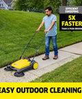 Person using Walk Behind Outdoor Push Sweeper S 4 Twin for Workshops and Garages Cleans Up to 5 Times Faster Than a Broom on sidewalk