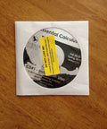 CD labeled 'Essential Calculus' in white paper sleeve on wooden surface, not showing 'Calculus Textbook Second Edition By Wright And Hurd, 810 Pages, Used Good Condition, English, Must Have Calculus Guide For Students And Self Learners Everyday'.