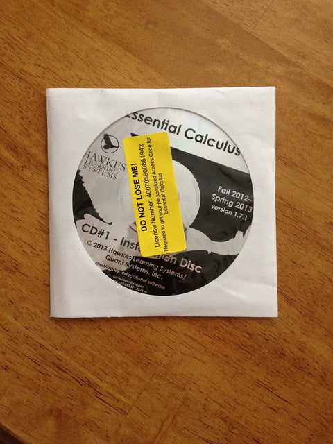 CD labeled 'Essential Calculus' in white paper sleeve on wooden surface, not showing 'Calculus Textbook Second Edition By Wright And Hurd, 810 Pages, Used Good Condition, English, Must Have Calculus Guide For Students And Self Learners Everyday'.