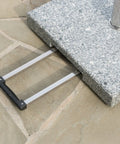 Close-up of Mojave Outdoor Granite And Stainless Steel Umbrella Base Natural Grey Built To Last Heavy Duty showing handle.
